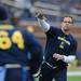 Former Michigan quarterback John Wangler throws the ball during the Victors Classic alumni football game at Michigan Stadium on Saturday. Melanie Maxwell I AnnArbor.com